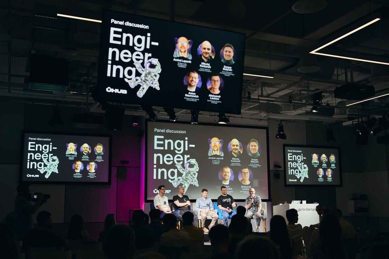 Panelists speaking at AI Shift Meetup 2026 at Google for Startups Campus in Warsaw, viewed from the audience.