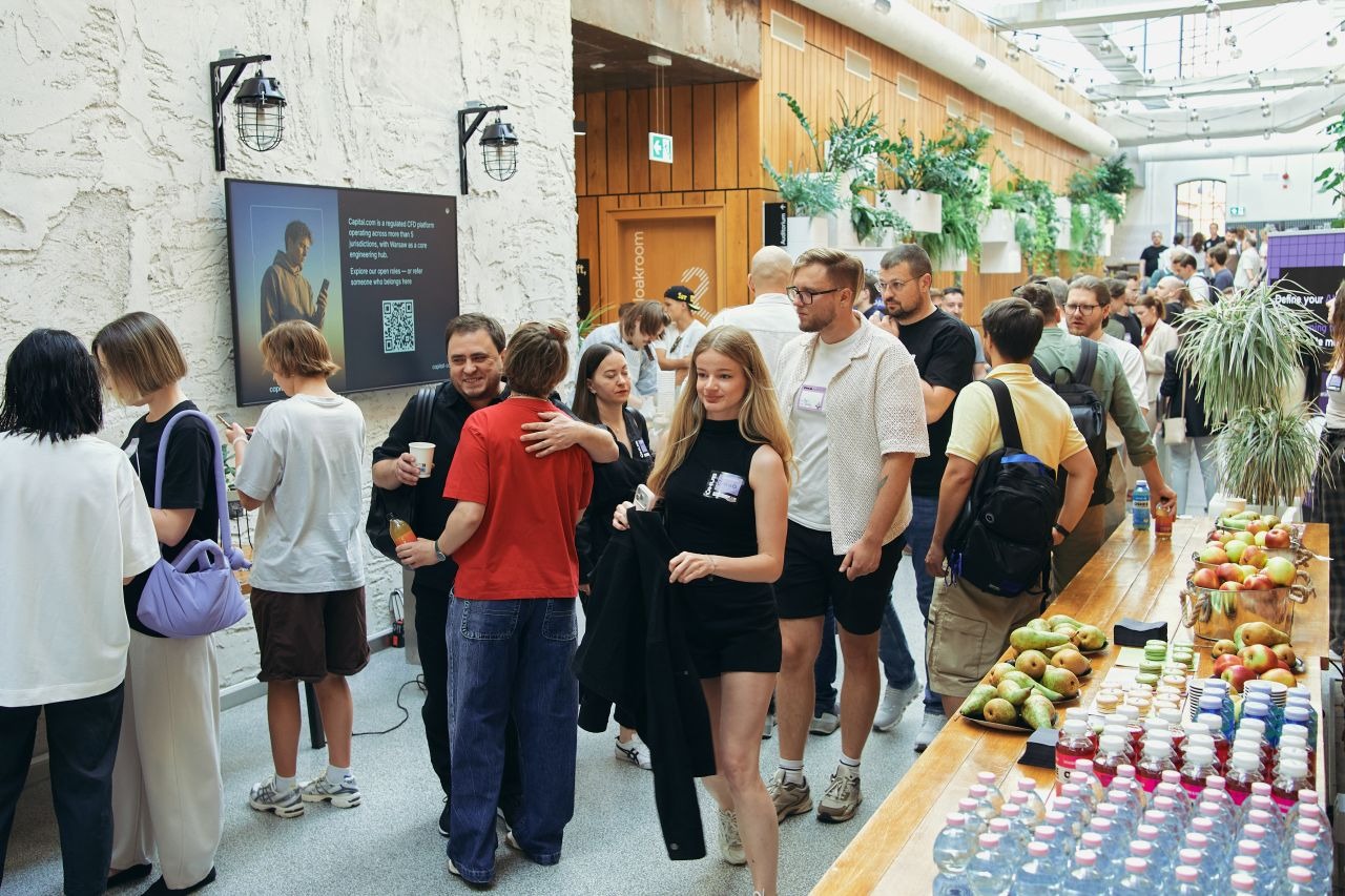 AI Shift Meetup attendees networking during a coffee break at the event venue.